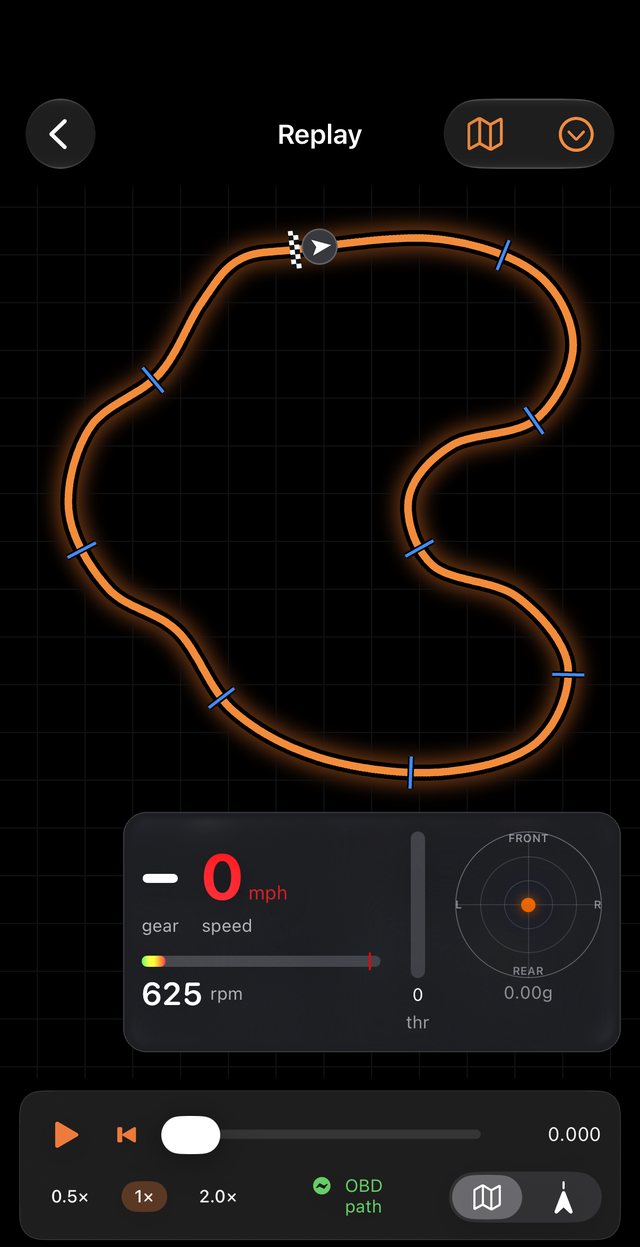 TrackDyno lap replay showing the racing line on a circuit map, sector times, lap times, gear, speed, RPM, throttle and a g-force meter